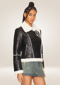 side pose of Stylish Women's Black Leather Bomber Jacket with Elegant Shearling Lining