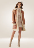 front pose of Women's Long Tan Leather Shearling Coat