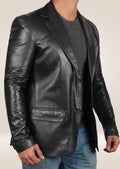 Men’s black lambskin blazer with a sleek lapel, combining luxury with sophistication for a modern yet classic look.