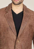 Model wearing the men's brown leather blazer, perfect for adding a polished touch to any outfit.