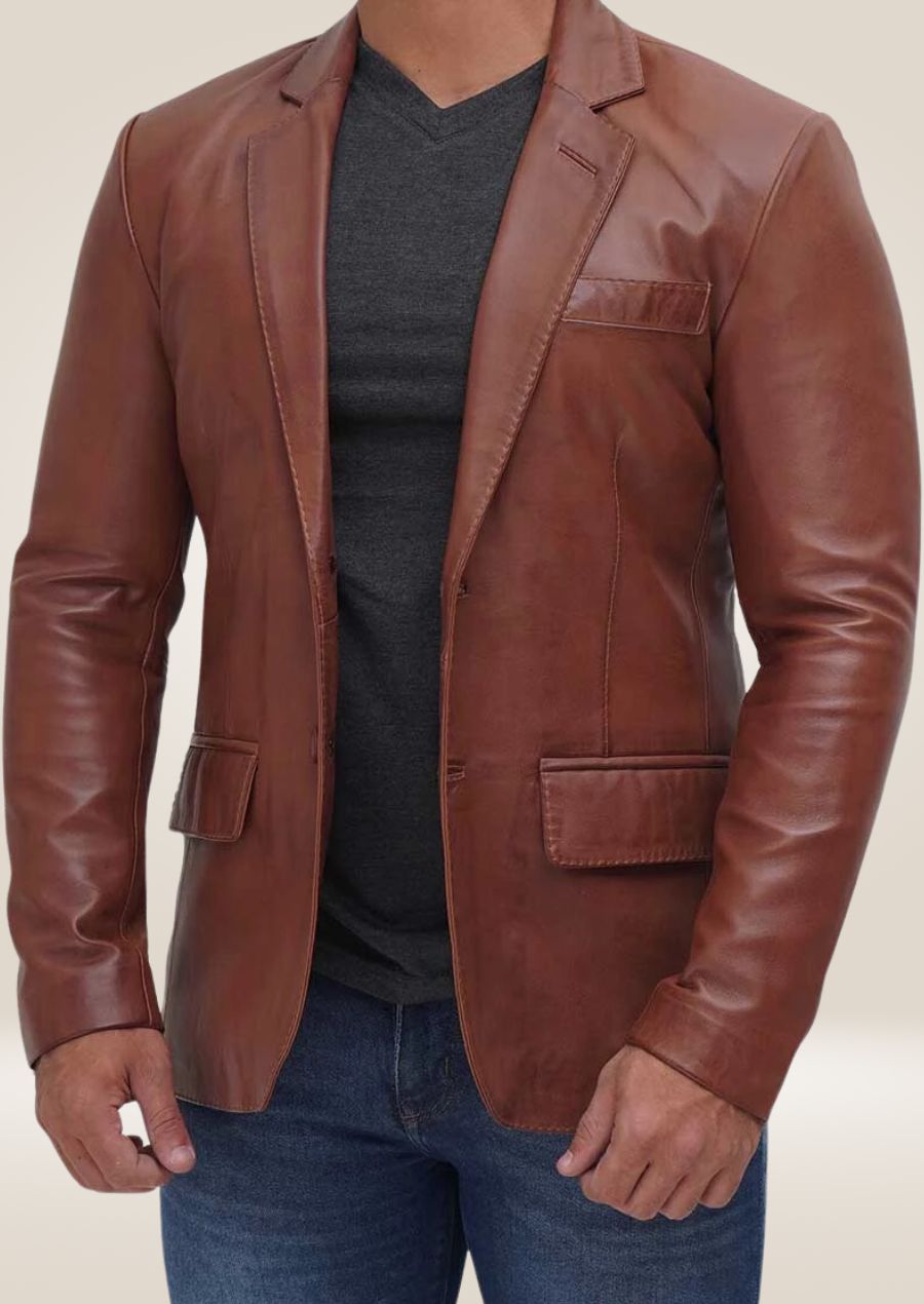 Men's brown leather two-button blazer with a tailored fit, combining classic sophistication with modern style.