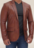 Model wearing the men's brown leather two-button blazer, showcasing its elegant design and timeless appeal.