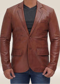 Men's brown leather two-button blazer with a tailored fit, combining classic sophistication with modern style.